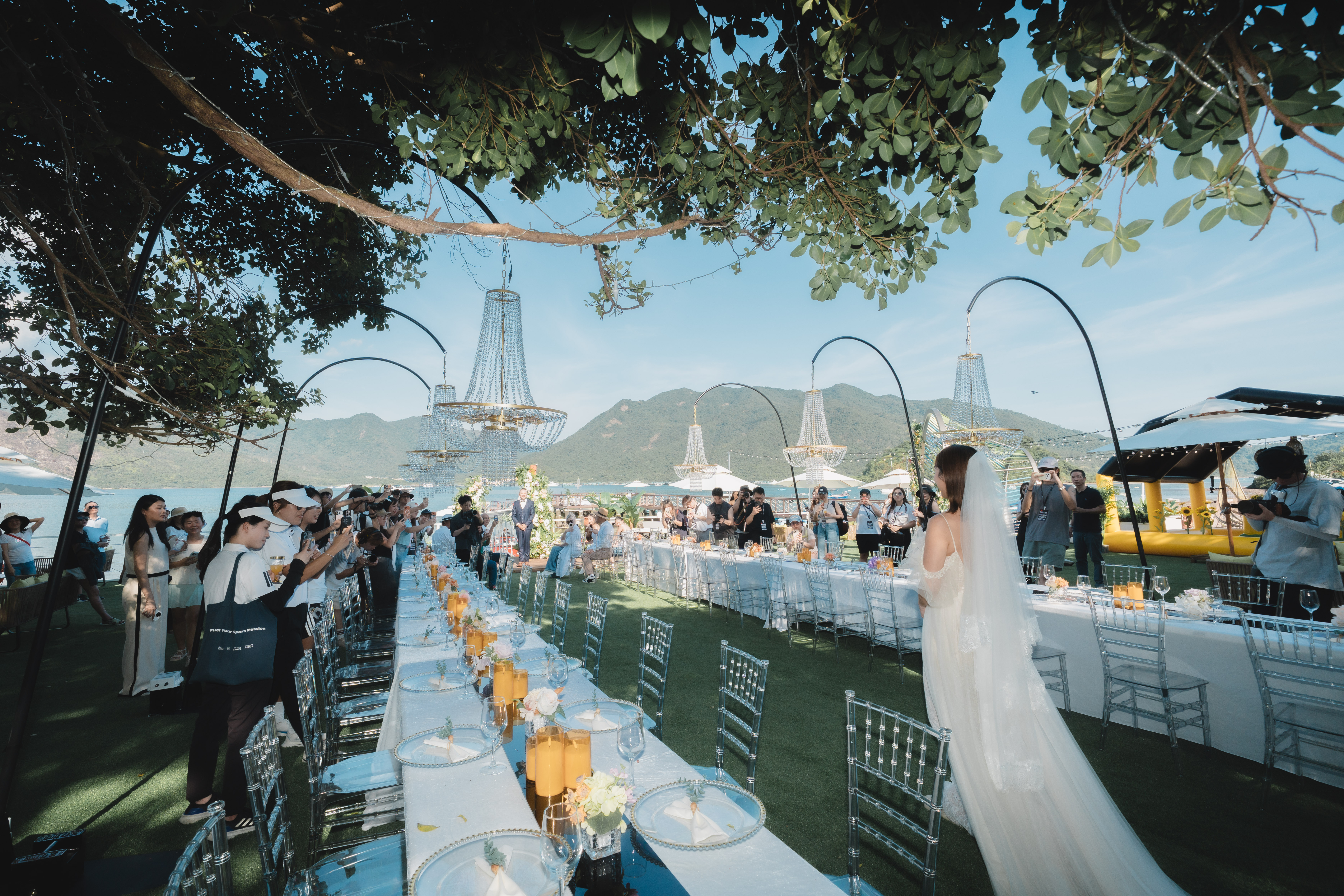 A waterfront wedding celebration at golden hour in Sai Kung